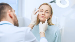 plastic surgeon consulting with patient